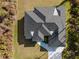 Overhead shot showcasing a home's roof, driveway, and well-maintained surrounding yard at 5823 Kumquat Ave, North Port, FL 34291