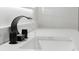 Modern bathroom faucet featuring waterfall design at 5823 Kumquat Ave, North Port, FL 34291