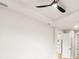 Bright bedroom featuring plank floors, tray ceilings, and a modern ceiling fan at 5823 Kumquat Ave, North Port, FL 34291