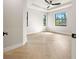 Spacious bedroom with plank floors, black trim windows, and a ceiling fan at 5823 Kumquat Ave, North Port, FL 34291