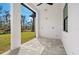 An empty covered patio offering an expansive view of the backyard at 5823 Kumquat Ave, North Port, FL 34291