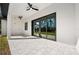 Covered patio with ceiling fans and beautiful view to the green backyard at 5823 Kumquat Ave, North Port, FL 34291