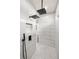 Modern shower featuring luxurious marble tile walls and dual shower heads at 5823 Kumquat Ave, North Port, FL 34291