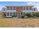 Two-story condo building with brick facade, multiple windows, and a metal roof at 22333 Edgewater Dr # E3, Punta Gorda, FL 33980