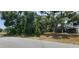 Vacant lot with mature trees and vegetation at 5367 Vantage St, North Port, FL 34288
