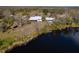 Aerial view of waterfront property with home and boat dock at 32091 Serene Dr, Punta Gorda, FL 33982