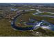 An aerial view of a property situated on a tranquil waterway in a natural setting at 32091 Serene Dr, Punta Gorda, FL 33982