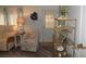 Living room features a comfortable armchair, gold shelf, and coastal decor at 6405 Kilohee Ct, North Port, FL 34287