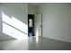 Bright bedroom with large window and door to another room at 26345 Trinilas Dr, Punta Gorda, FL 33983
