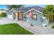Well-maintained house with a landscaped yard, attached garage, and a US flag at 5001 Richmond Ter, North Port, FL 34287