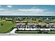 Community overview featuring multiple buildings and lush landscape at 17258 Acapulco Rd # 122, Punta Gorda, FL 33955