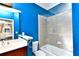 Bright bathroom with a tub, shower, and updated vanity at 17258 Acapulco Rd # 122, Punta Gorda, FL 33955