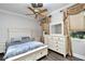 Bright bedroom with a queen-size bed and white dresser at 17258 Acapulco Rd # 122, Punta Gorda, FL 33955