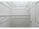Large walk-in closet with wire shelving and hanging rods at 17258 Acapulco Rd # 122, Punta Gorda, FL 33955