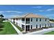 Two-story building with light-colored exterior and balconies at 17258 Acapulco Rd # 122, Punta Gorda, FL 33955
