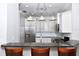 Kitchen with granite breakfast bar and stainless steel appliances at 17258 Acapulco Rd # 122, Punta Gorda, FL 33955
