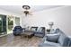 Spacious living room featuring hardwood floors and ample natural light at 17258 Acapulco Rd # 122, Punta Gorda, FL 33955
