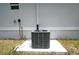 New AC unit sits on a concrete slab outside the home at 2163 Blaser St, Punta Gorda, FL 33980