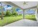 Covered patio with ceiling fan overlooking a grassy backyard at 2163 Blaser St, Punta Gorda, FL 33980