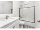 Modern bathroom with a large vanity, quartz countertop, and a glass-enclosed shower at 2163 Blaser St, Punta Gorda, FL 33980