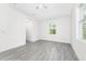 Bright bedroom with wood-look tile flooring and large window at 2163 Blaser St, Punta Gorda, FL 33980