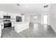 Bright, modern kitchen featuring stainless steel appliances, quartz countertops, and an island at 2163 Blaser St, Punta Gorda, FL 33980