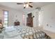 Bright bedroom with king-size bed and ceiling fan at 2484 Broad Ranch Dr, Port Charlotte, FL 33948