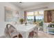 Bright dining room with a large window and white table setting at 2484 Broad Ranch Dr, Port Charlotte, FL 33948