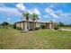 Single-story house with stone accents and lush landscaping at 2484 Broad Ranch Dr, Port Charlotte, FL 33948