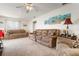 Bright living room featuring two sofas and a ceiling fan at 2484 Broad Ranch Dr, Port Charlotte, FL 33948