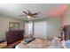 Bedroom with dresser, ceiling fan, and large closet at 2736 Suncoast Lakes Blvd, Punta Gorda, FL 33980