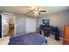 Spacious bedroom with a desk and large closet at 2736 Suncoast Lakes Blvd, Punta Gorda, FL 33980