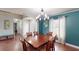 Formal dining room with hardwood floors and teal walls at 2736 Suncoast Lakes Blvd, Punta Gorda, FL 33980