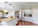 Modern kitchen with island, white cabinets, and stainless steel appliances at 2736 Suncoast Lakes Blvd, Punta Gorda, FL 33980