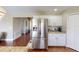 Modern kitchen featuring stainless steel refrigerator and granite countertops at 2736 Suncoast Lakes Blvd, Punta Gorda, FL 33980