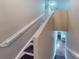 Staircase leading to the upper level of the home at 2736 Suncoast Lakes Blvd, Punta Gorda, FL 33980