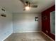 Bedroom with ceiling fan and a built-in shelving unit at 1405 Dorchester St, Port Charlotte, FL 33952