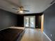 Bedroom with grey walls and sliding doors leading to backyard at 1405 Dorchester St, Port Charlotte, FL 33952