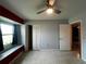 Bright bedroom featuring a window seat and ceiling fan at 1405 Dorchester St, Port Charlotte, FL 33952