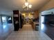 Bright kitchen with light wood cabinets and granite countertops at 1405 Dorchester St, Port Charlotte, FL 33952