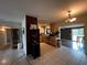 Bright kitchen features ample cabinetry and a view into the adjacent dining area at 1405 Dorchester St, Port Charlotte, FL 33952