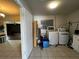 Laundry room with washer, dryer and storage cabinets at 1405 Dorchester St, Port Charlotte, FL 33952