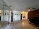 Living room with mirror wall and view into dining area at 1405 Dorchester St, Port Charlotte, FL 33952