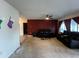 Living Room with dark brown leather couches and burgundy walls at 1405 Dorchester St, Port Charlotte, FL 33952