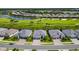 Aerial view of luxury homes with golf course and lake views at 25133 Longmeadow Dr, Punta Gorda, FL 33955