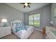 Guest bedroom with white bed frame and coastal decor at 25133 Longmeadow Dr, Punta Gorda, FL 33955