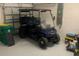 Spacious garage with golf cart and ample storage at 25133 Longmeadow Dr, Punta Gorda, FL 33955