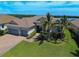 Single-Gathering home with two-car garage and landscaped yard at 15240 Spanish Point Dr, Port Charlotte, FL 33981