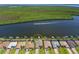 Expansive aerial view of a waterfront home with a private dock and access to the Gulf at 15240 Spanish Point Dr, Port Charlotte, FL 33981