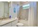 Bathroom with tub shower combination and granite countertop at 15240 Spanish Point Dr, Port Charlotte, FL 33981